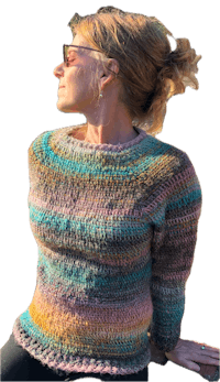 a woman wearing a multicolored sweater