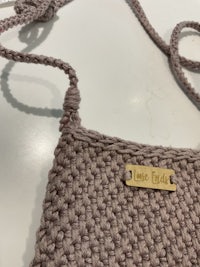 a crocheted bag with a name on it