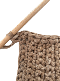 a crocheted stitch with a wooden crochet hook